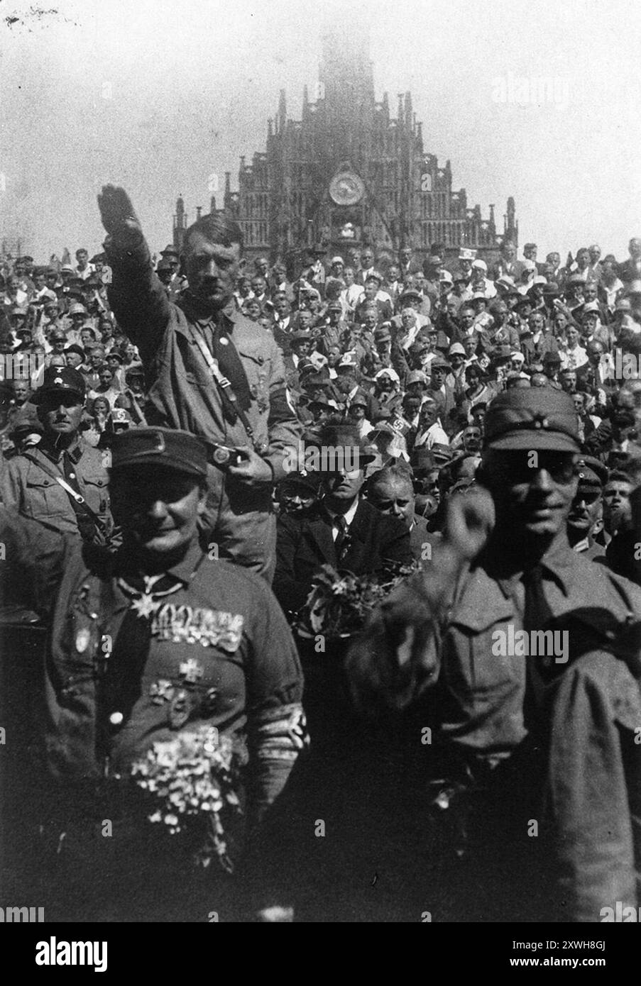 Adolf Hitler giving he Nazi salute at a Reich Party Day rally in Nuremberg. Hermann Göring is stood in front if him. The photo is dated 1927 Stock Photo