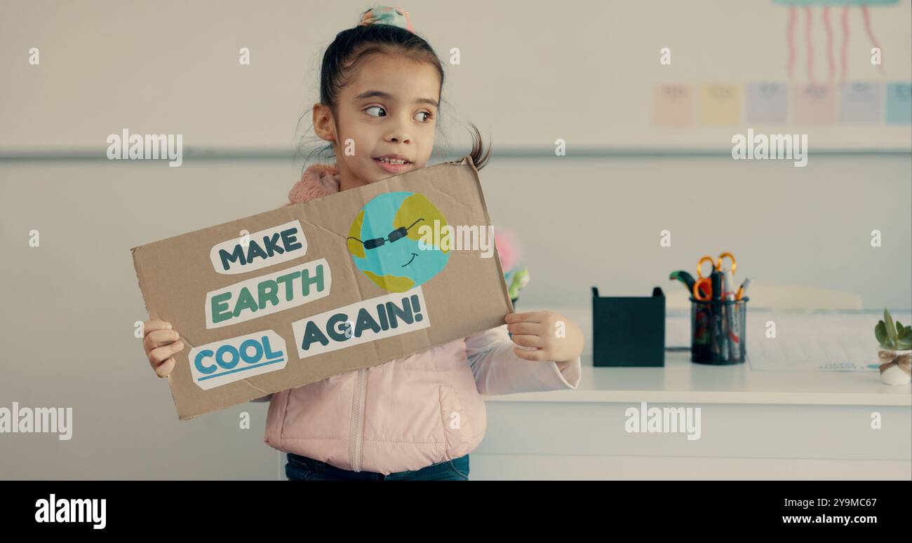 School, student and child with poster for presentation, education and awareness for climate change. Classroom, girl and thinking with oral speech for Stock Photo