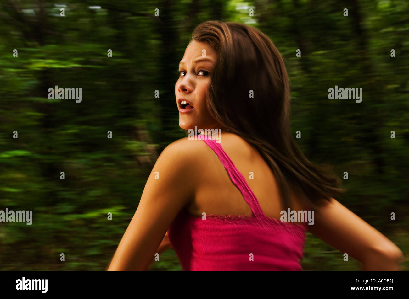 Scared 15 yr old teen girl running away Stock Photo