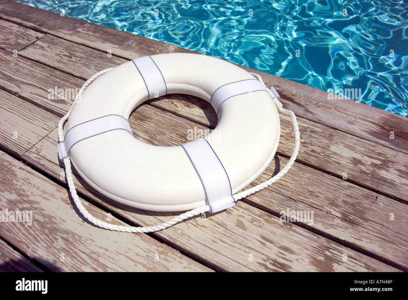 Life preserver on pool deck life jacket Stock Photo