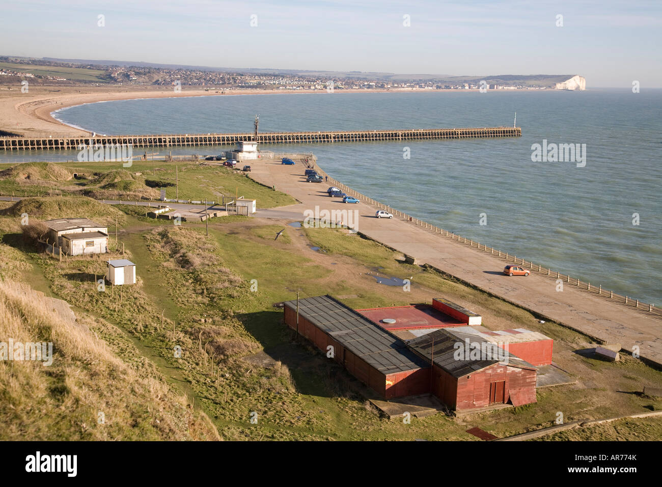 Newhaven beach and harbour mouth. Seaford Head in the distance. Stock Photo