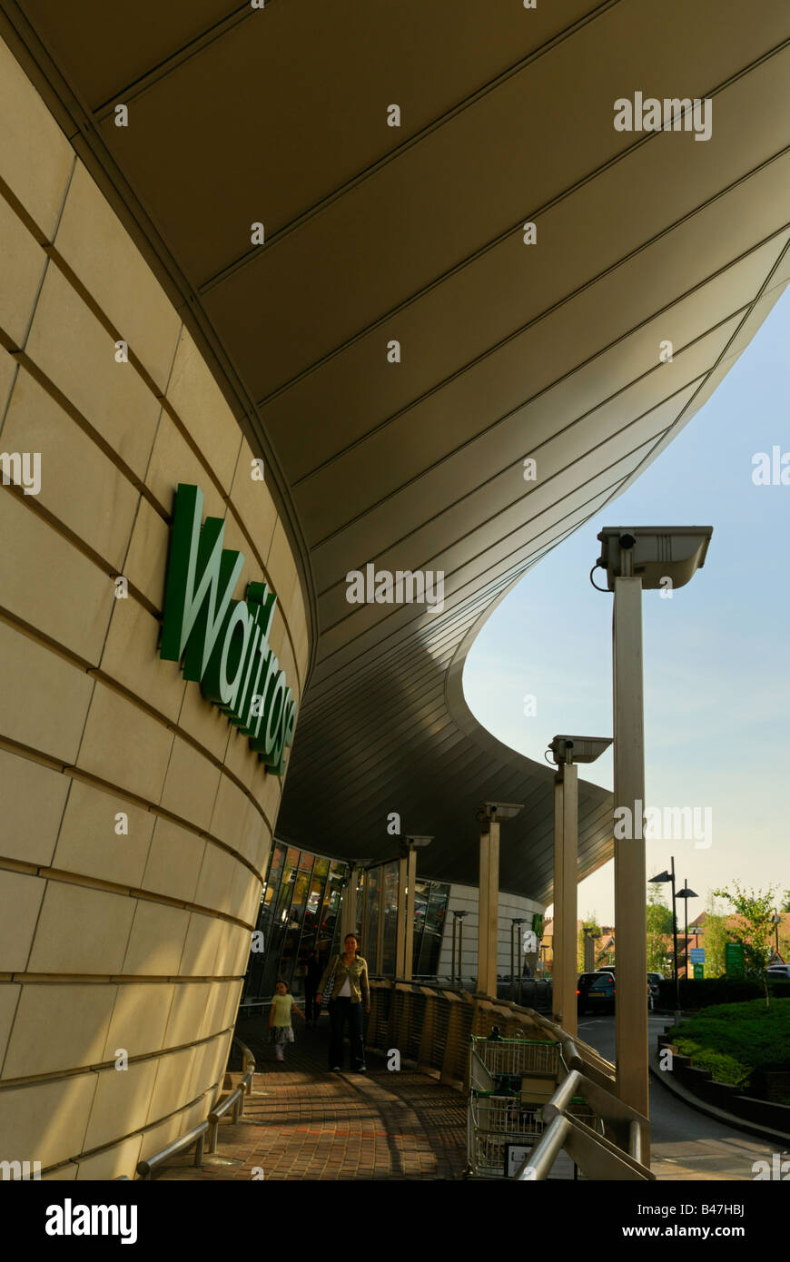 Sweeping curve of the roof at the entrance to Waitrose supermarket in Surbiton, England Stock Photo