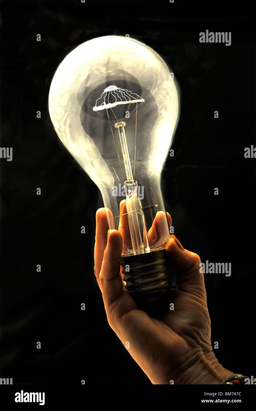 Light bulb in hand Stock Photo