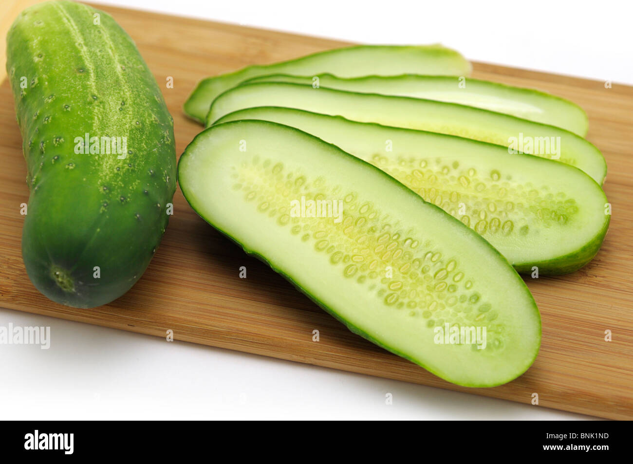 Whole and Sliced Cucumbers Stock Photo