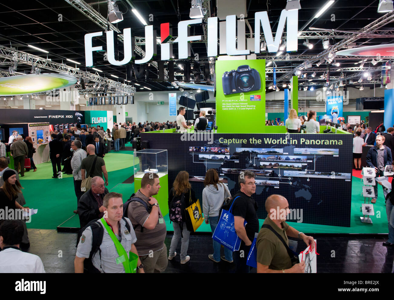 Crowds passing Fujifilm stand at Photokina digital imaging trade show in Cologne Germany Stock Photo