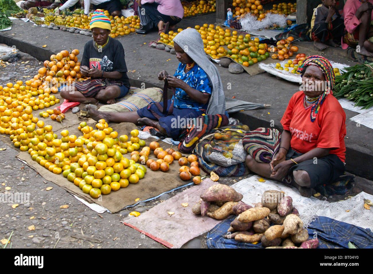 Women selling produce at market, Wamena, Papua, Indonesia Stock Photo