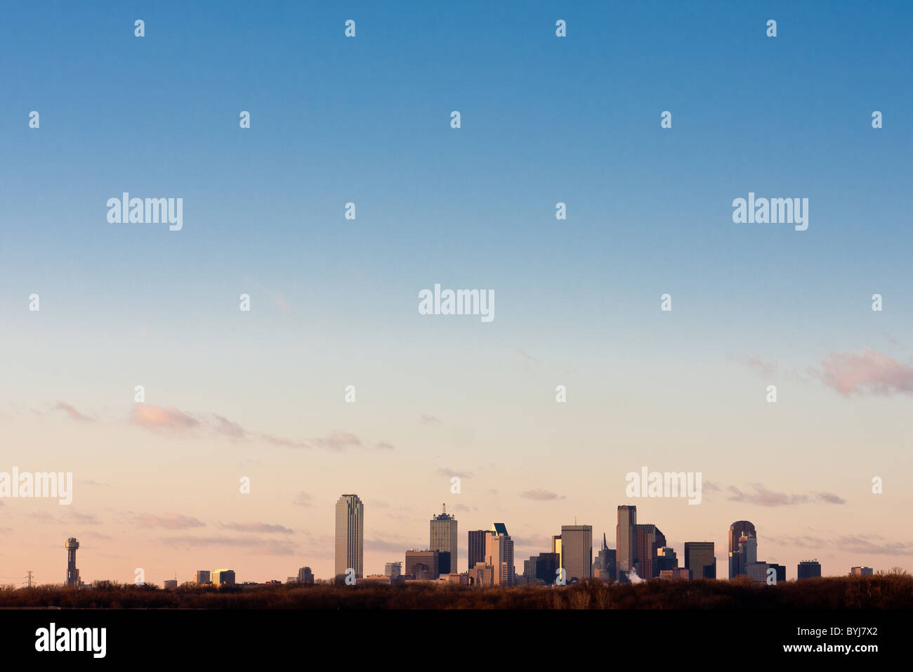 Wide angle view of Dallas, Texas skyline from the south at the I-45 Interstate bridge over the Trinity River in late afternoon. Stock Photo