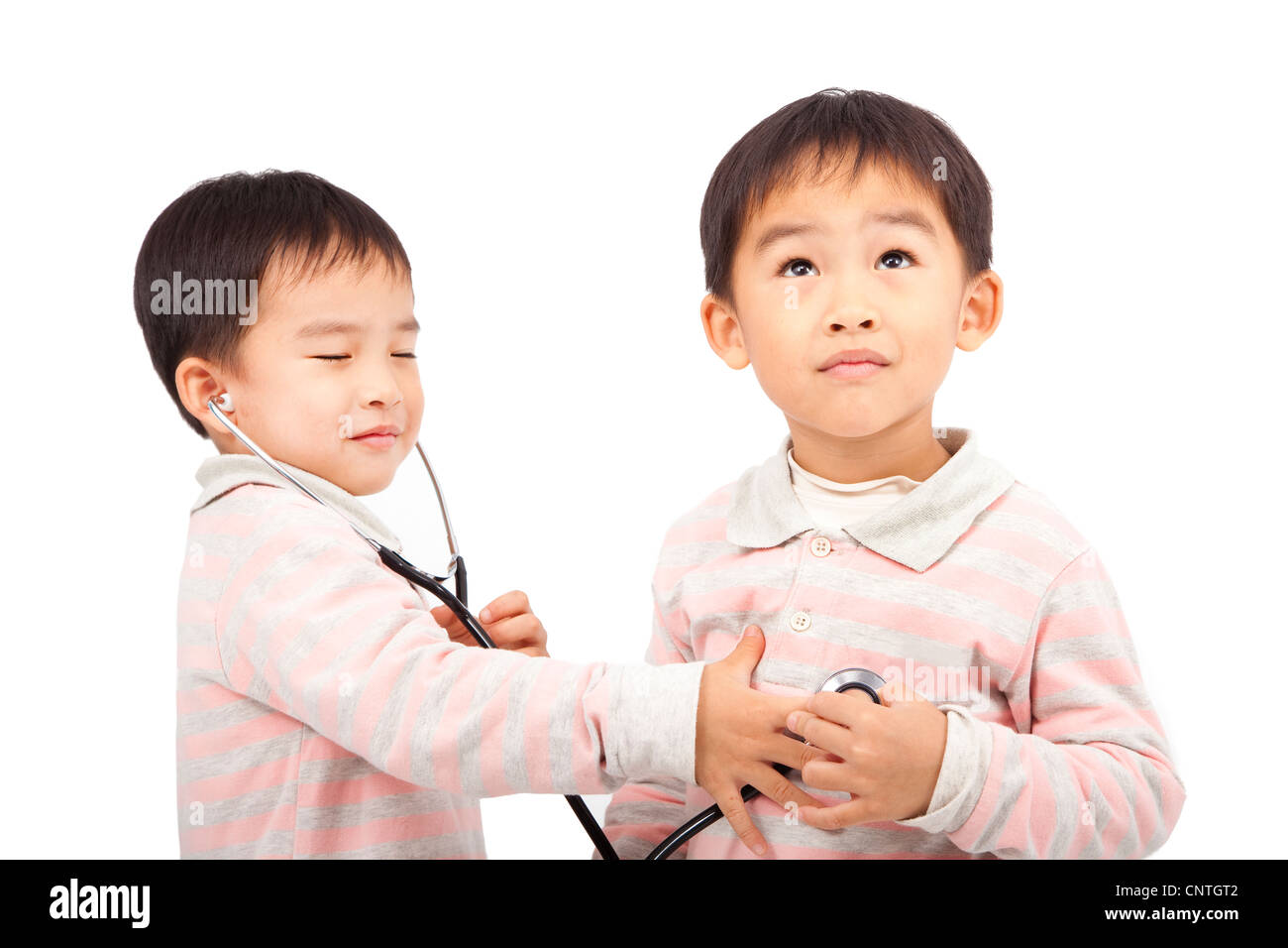 two boys using stethoscope Check the heartbeat Stock Photo