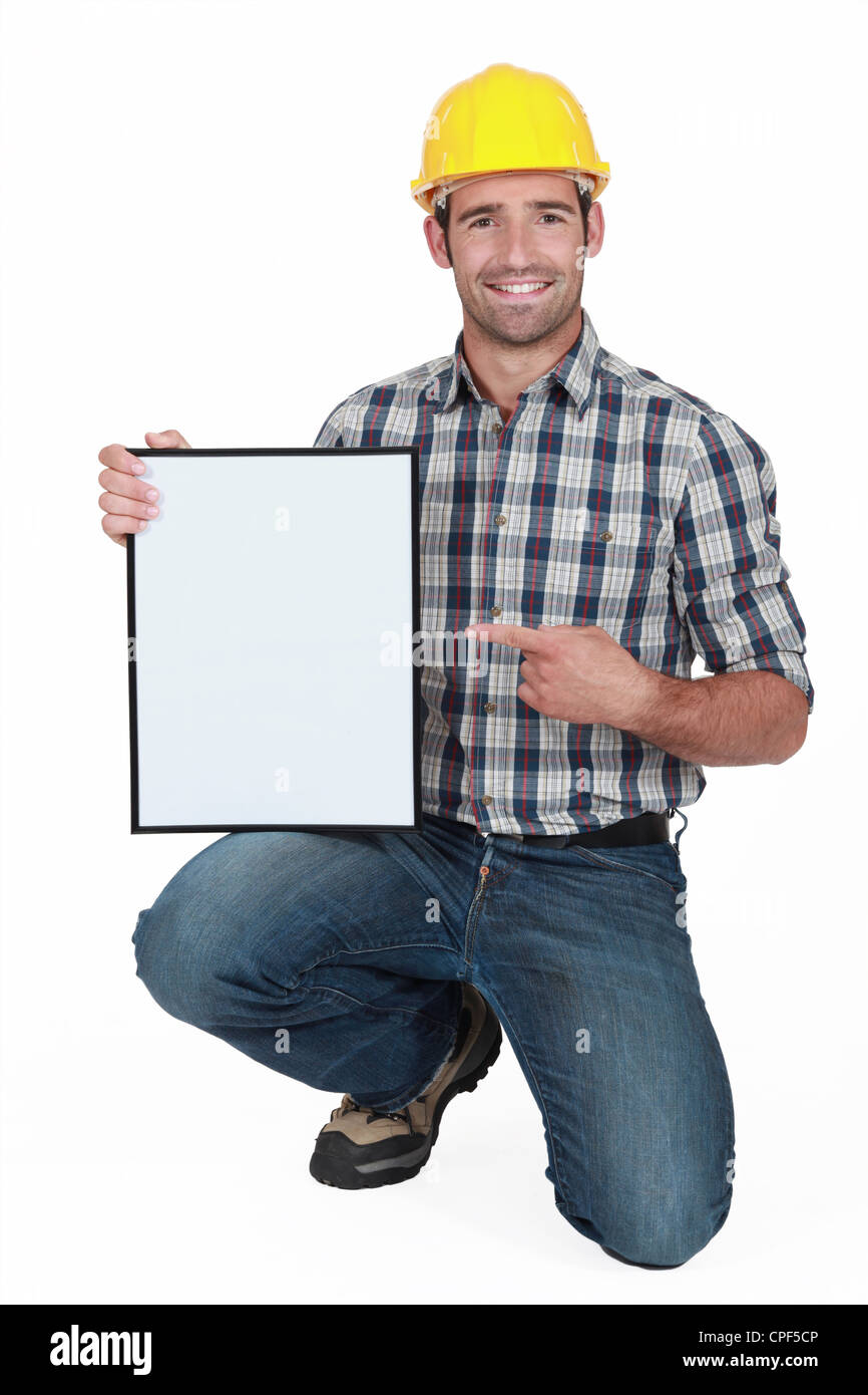 craftsman pointing at a blank board Stock Photo