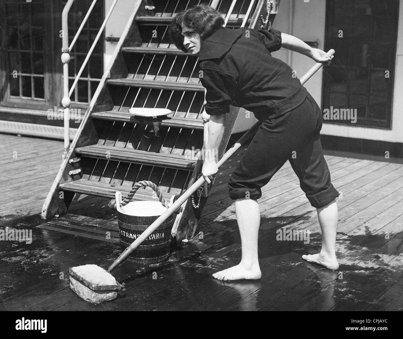 American sailor while scrubbing the deck, 1926 Stock Photo