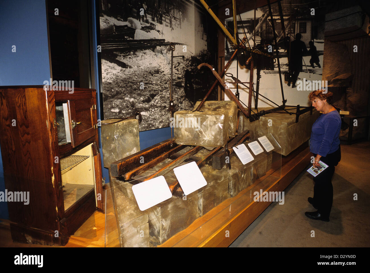 Elk282-1027 Maine, Augusta, Maine State Museum, woman viewing ice cutting exhibit Stock Photo