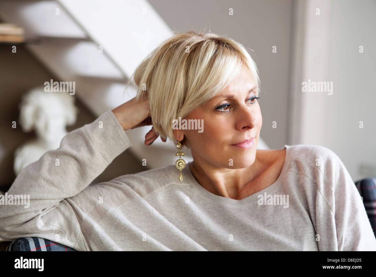 Pensive beautiful blond woman Stock Photo