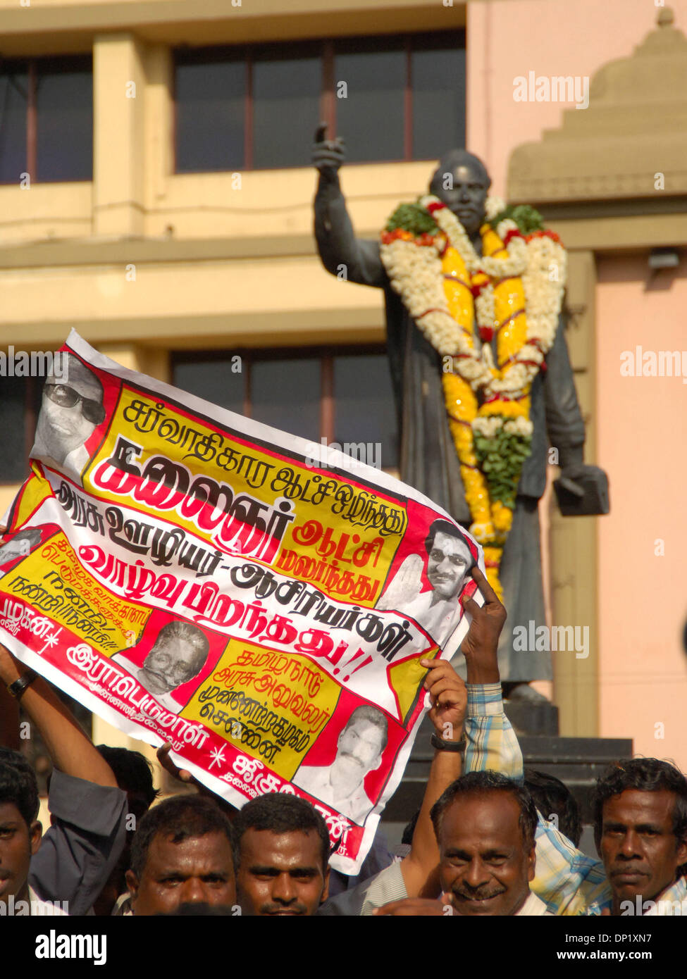 May 11, 2006; Chennai, Tamil Nadu, INDIA; DMK Supports stand outside of the DMK headquarters in Chennai, India. DMK has claimed victory over the former ruling party AIADMK. This is the fifth time DMK President M. Karunanidhi has become Cheif Minister of Tamil Nadu.    Mandatory Credit: Photo by Daniel Wilkinson/ZUMA Press. (©) Copyright 2006 by Daniel Wilkinson Stock Photo