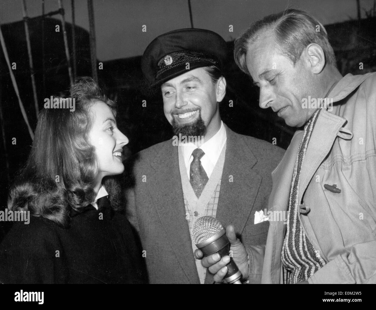 Biologist Hans Hass is interviewed on deck Stock Photo