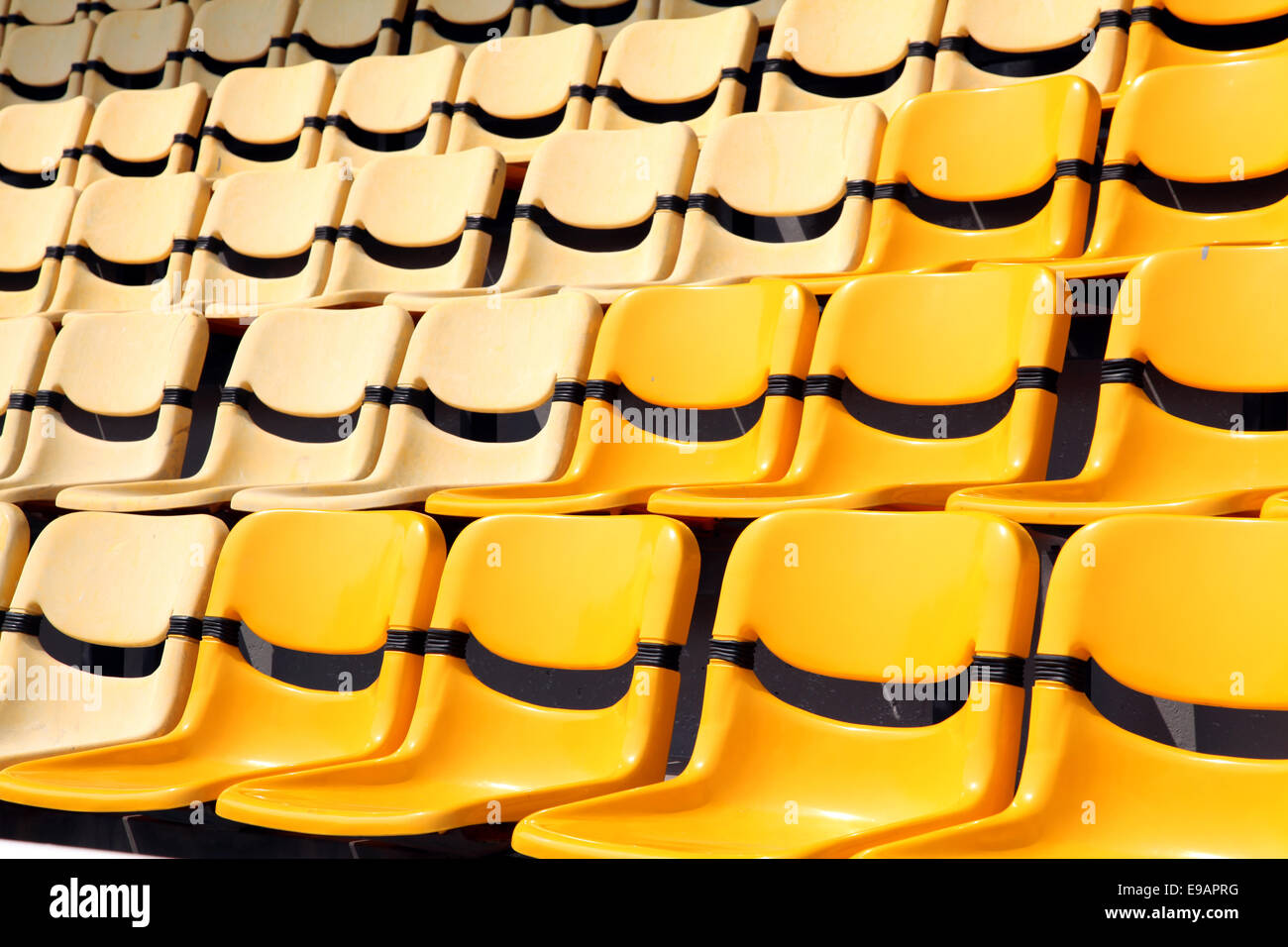 old and new yellow seat in stadium Stock Photo