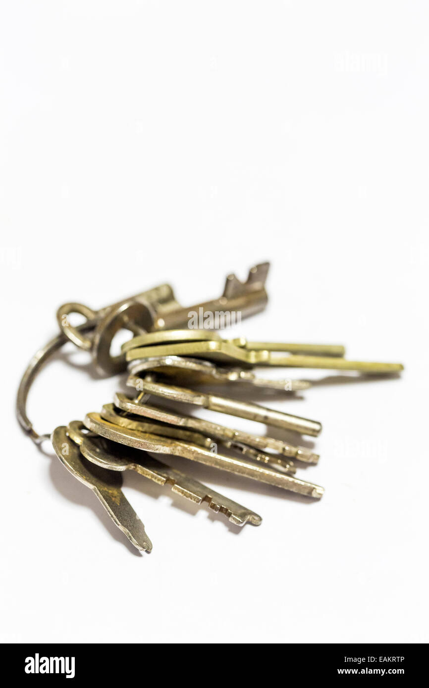 Old keys on keyring on a plain white background Stock Photo