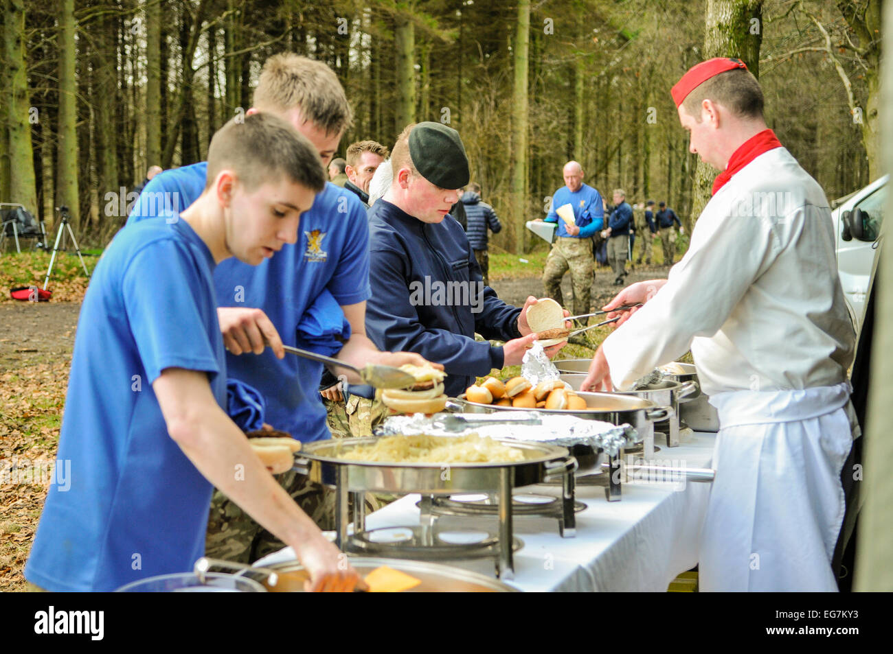 Bangor, Northern Ireland. 18th February, 2015. Army field kitchen staff serve hamburgers to soldiers in a forest location. Credit:  Stephen Barnes/Alamy Live News Stock Photo