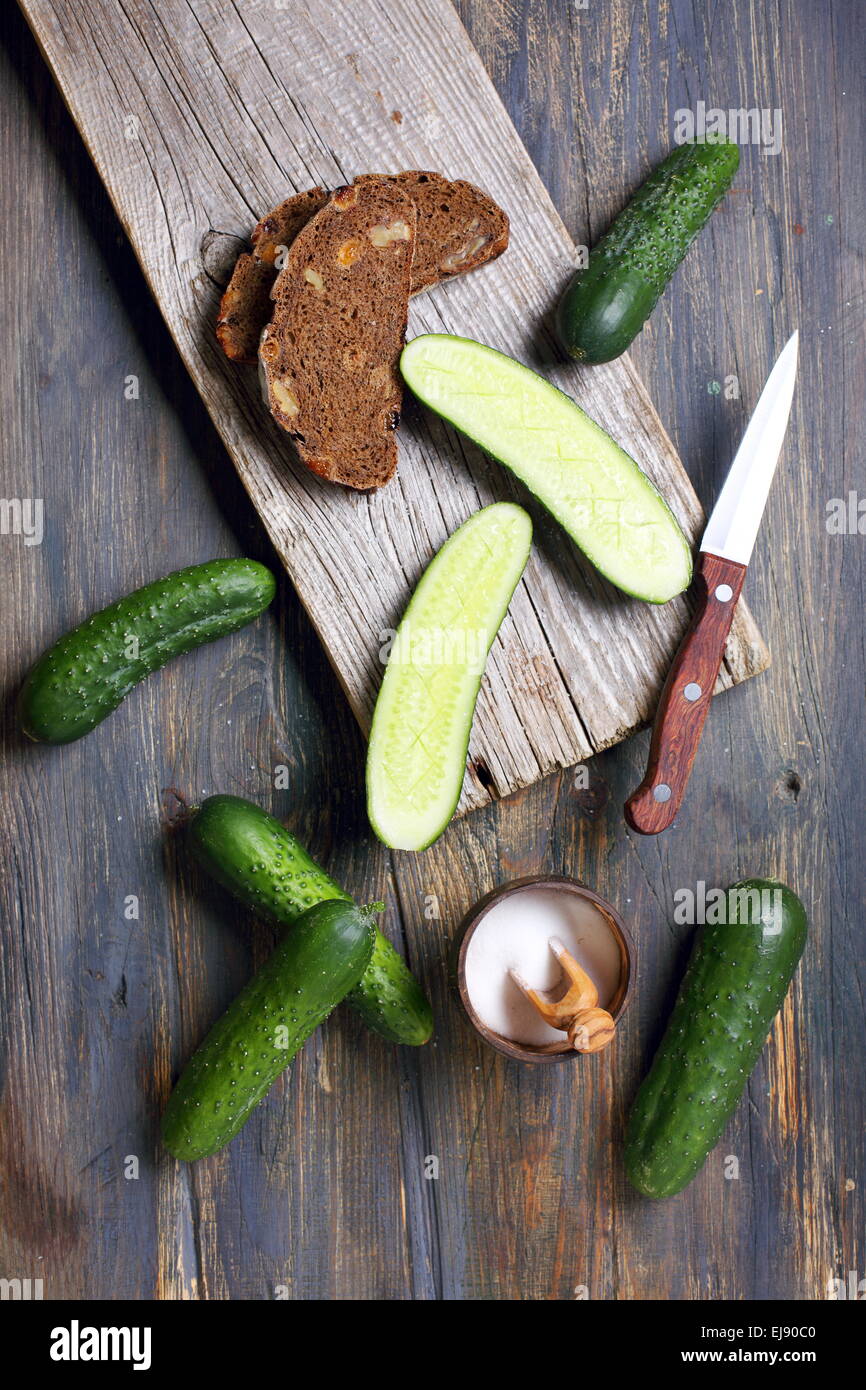 Cucumbers and black bread. Stock Photo