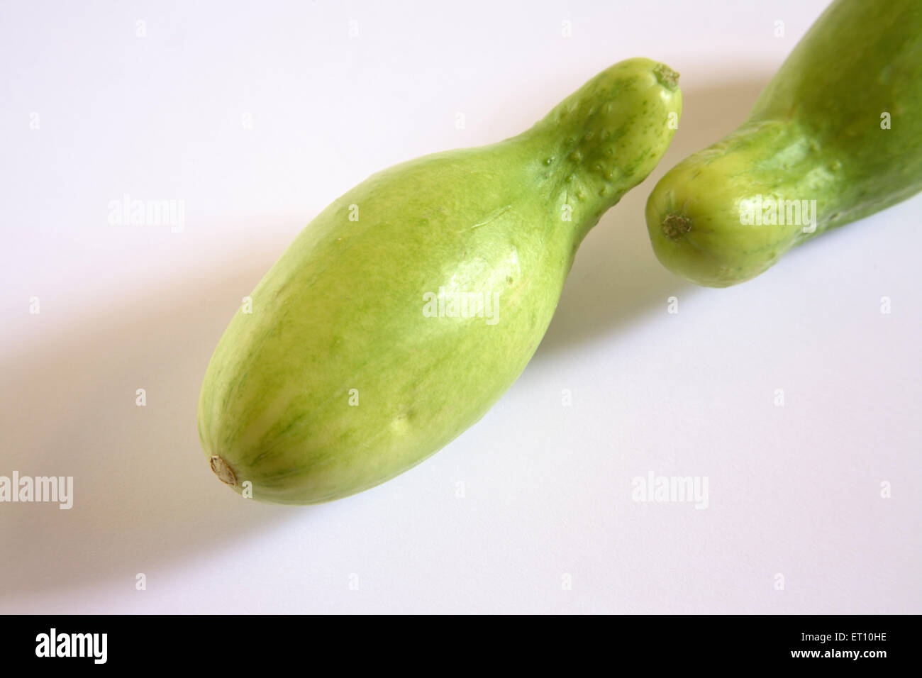 Green vegetable ; kakri cucumbers cucumis utilissimus on white background Stock Photo