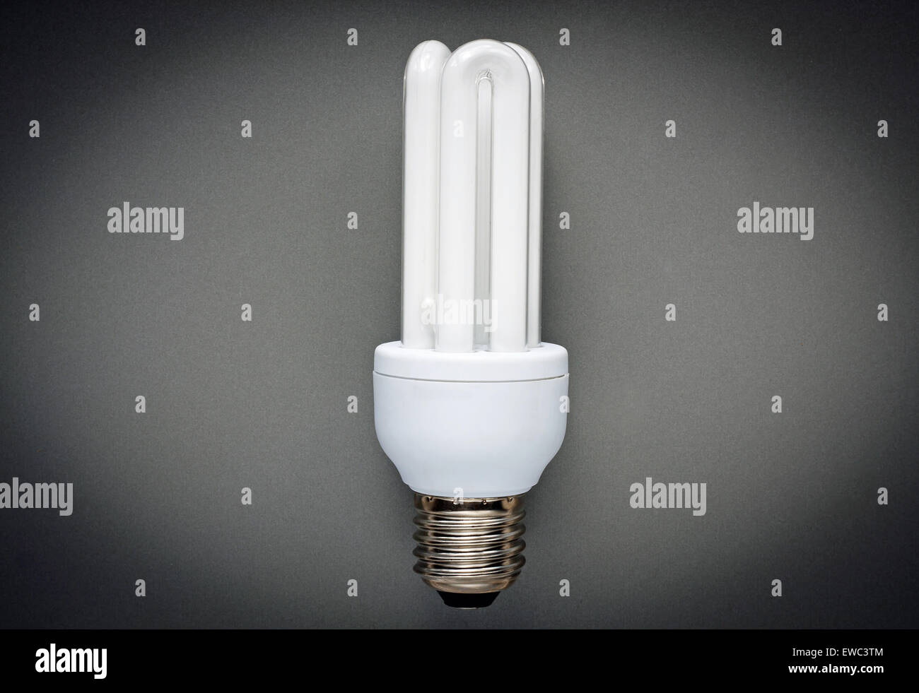 Energy saving bulb on grey background Stock Photo