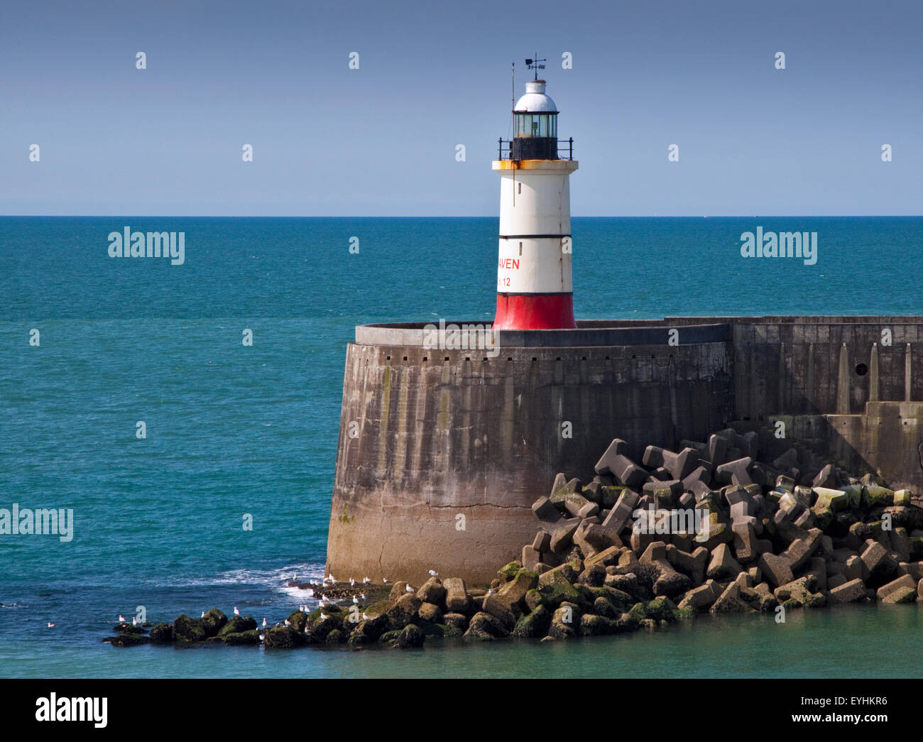 Lighthouse and Harbour Wall, Port of Newhaven, East Sussex, England Stock Photo