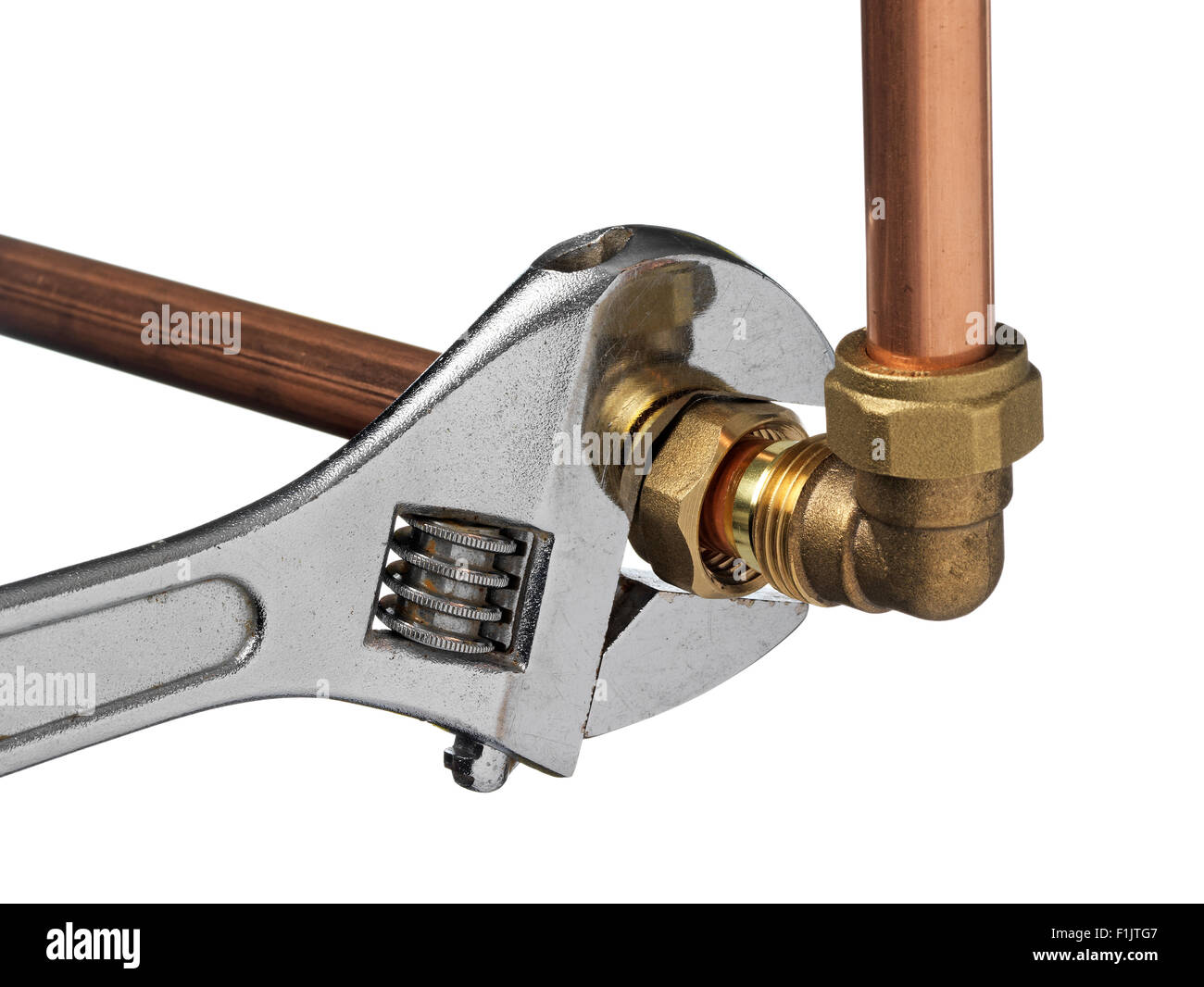 Copper pipe and wrench Stock Photo