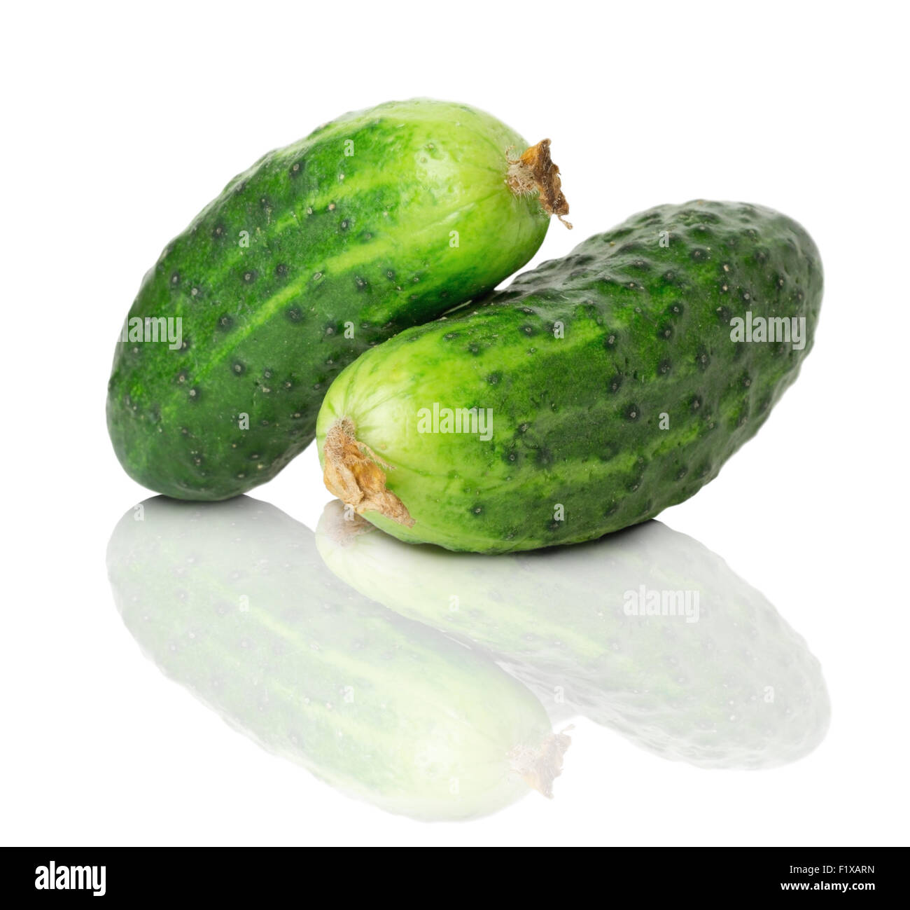 two cucumbers on the white background. Stock Photo