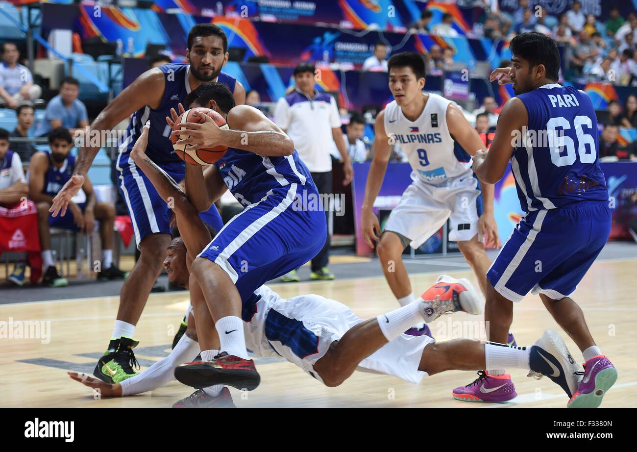 Changsha, China's Hunan Province. 29th Sep, 2015. C. Abueva (Bottom) of the Philippines falls down during a match against India at 2015 FIBA Asia Champinship in Changsha, capital of central China's Hunan Province, Sept. 29, 2015. The Philippines won 99-66. © Li Ga/Xinhua/Alamy Live News Stock Photo