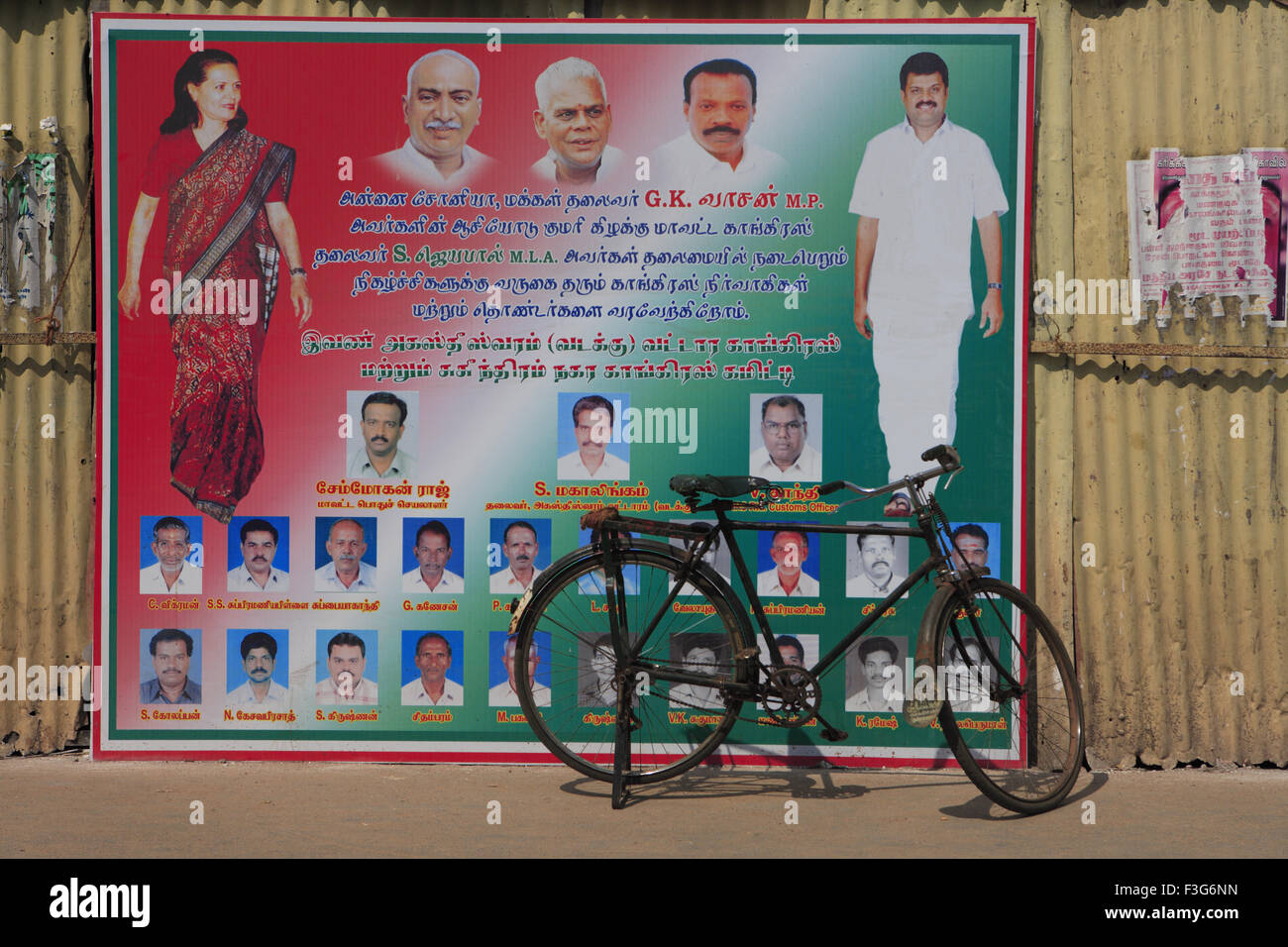 Sonia Gandhi on DMK political party poster ; parked cycle ; Suchindram ; Kanniyakumari ; Kanyakumari ; Tamil Nadu ; India ; Asia Stock Photo