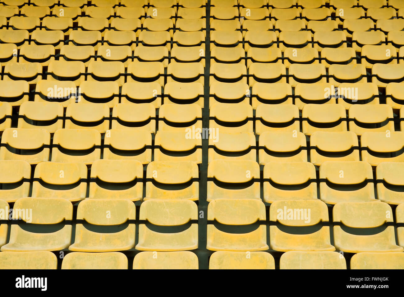 Yellow Seat Pattern in Football Stadium Stock Photo