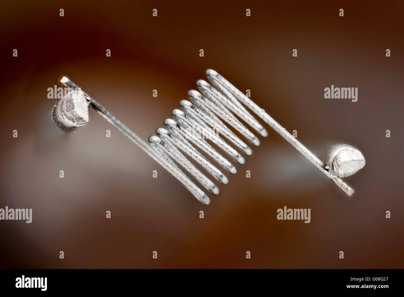 Tungsten bulb filament of a microscope lamp, designed to enable Köhler illumination. Stock Photo