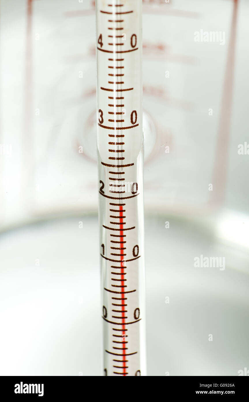 Thermometer measures the temperature of the water Stock Photo