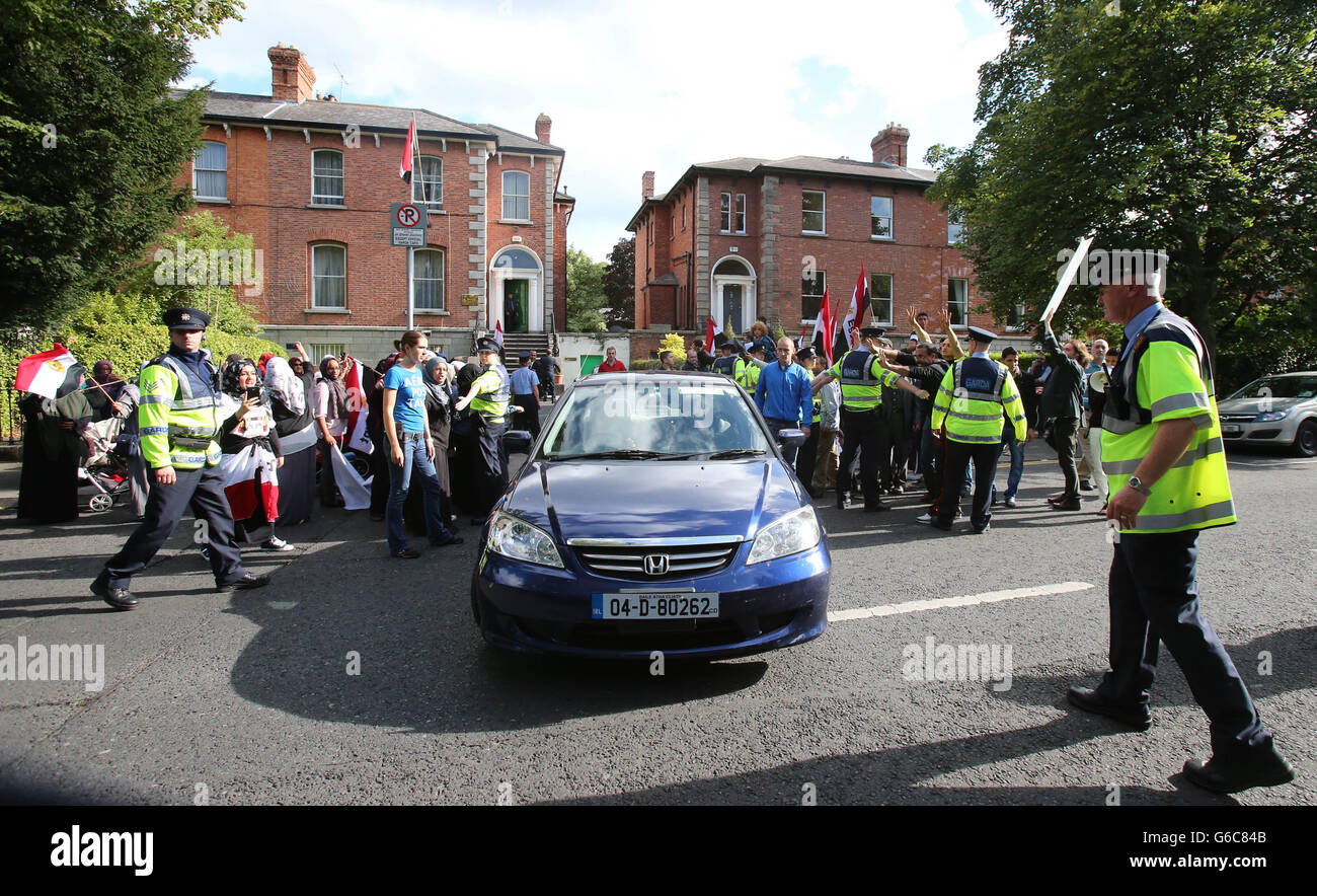 Friends of the Halawa family jeer at cars leaving the Egyptian Embassy in Dublin as they call for their release from custody. Stock Photo