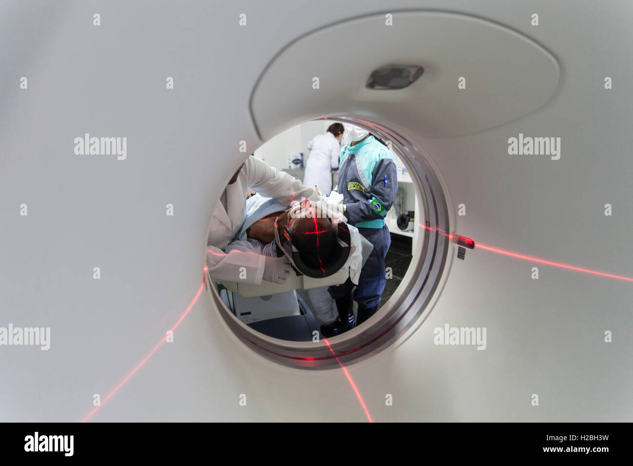 Patient in medical MRI scanner, magnetic resonance imaging, a medical imaging technique used in radiology to image the anatomy and the physiological processes of the body in both health and disease - MRI scanners use strong magnetic fields, radio waves, and field gradients to form images of the body. Stock Photo