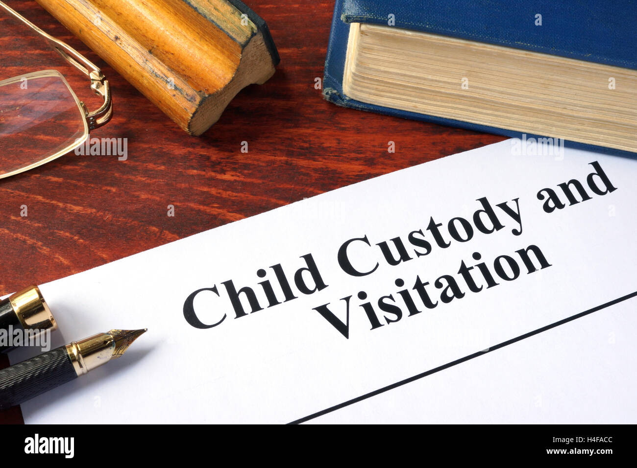 Child Custody and Visitation written on a paper and a book. Stock Photo