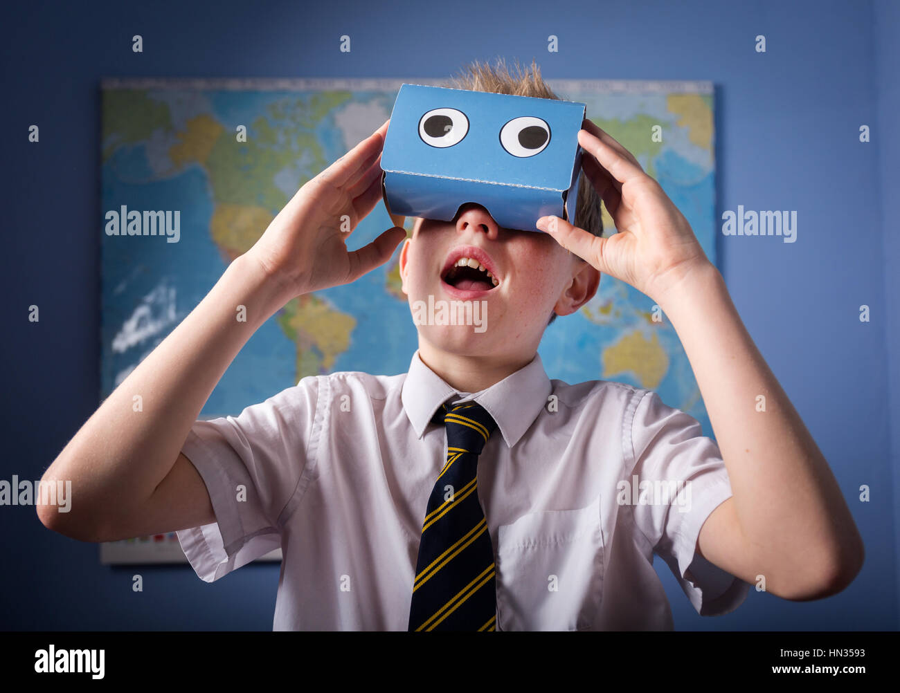 A School Pupil exploring the world through a VR Virtual Reality headset Stock Photo