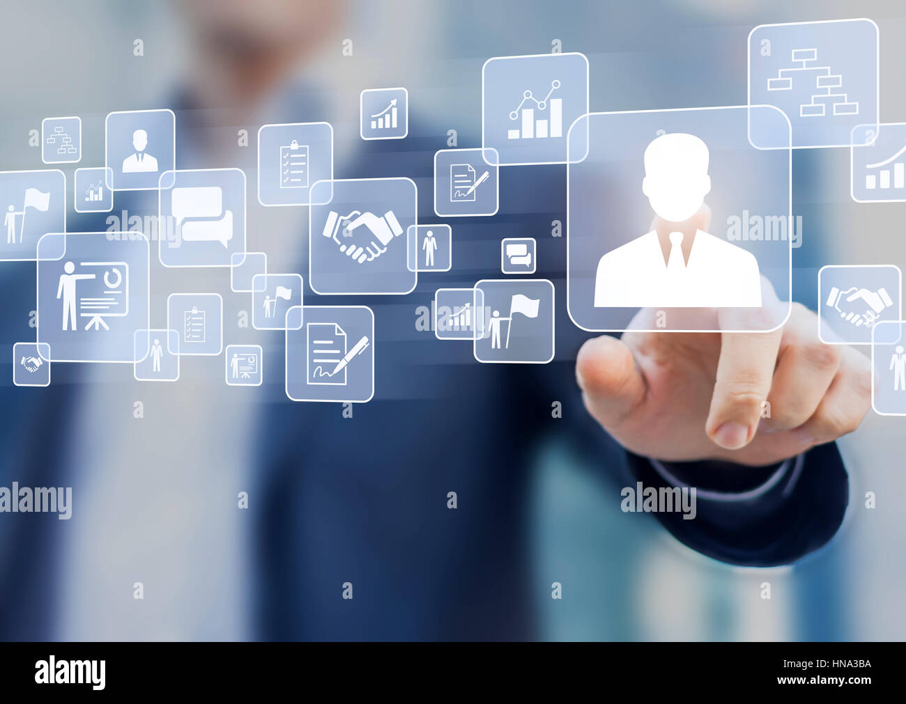 Human resources (HR) management concept on a virtual screen interface with a business person in background and icons about recruiting, technology data Stock Photo