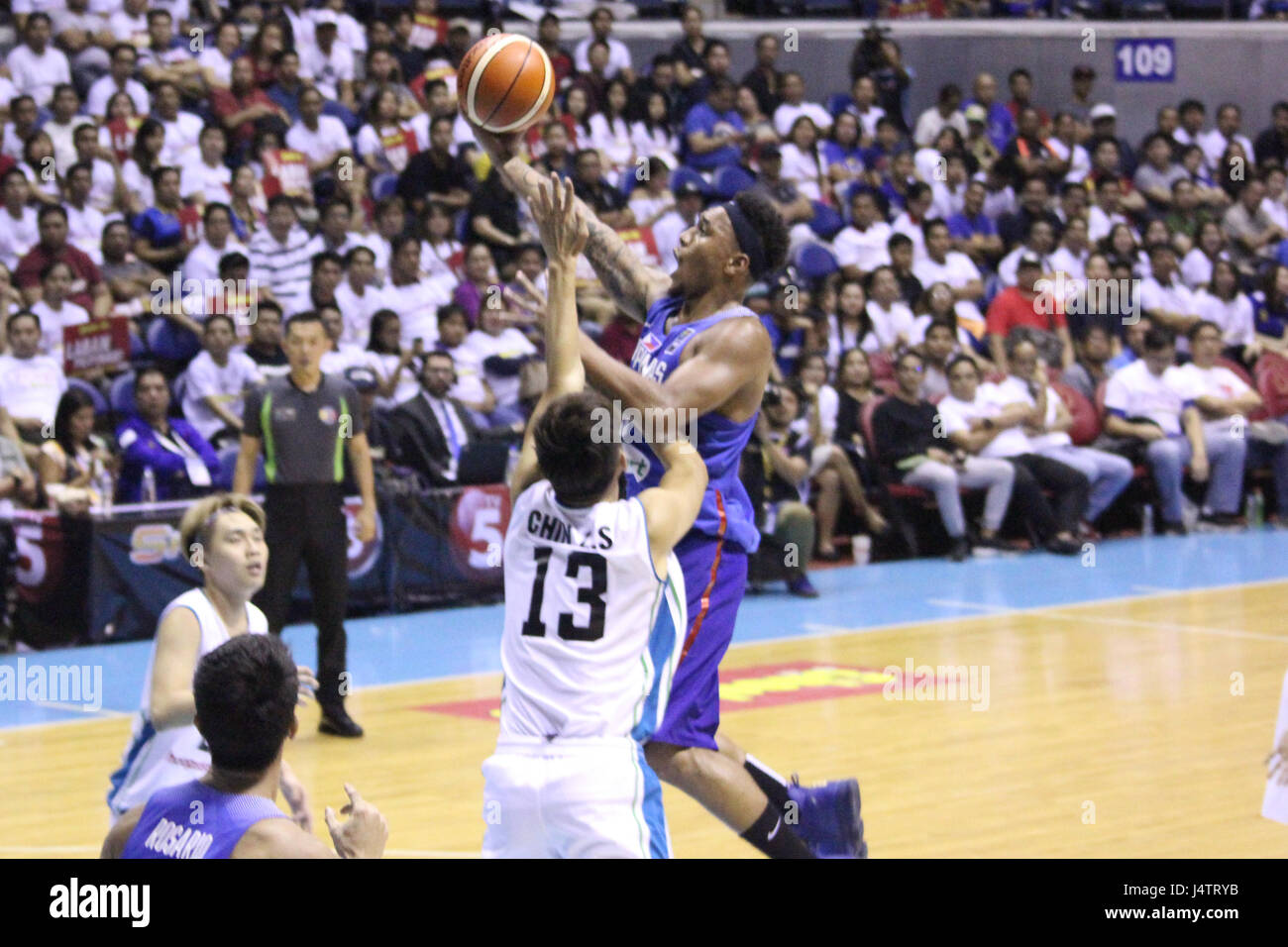 Quezon City, Philippines. 14th May, 2017. Calvin Abueva (8) of the Philippines tries to lay-up the ball over defender Chin Zhi Shin (13) of Malaysia during their basketball game. Credit: Dennis Jerome Acosta/Pacific Press/Alamy Live News Stock Photo