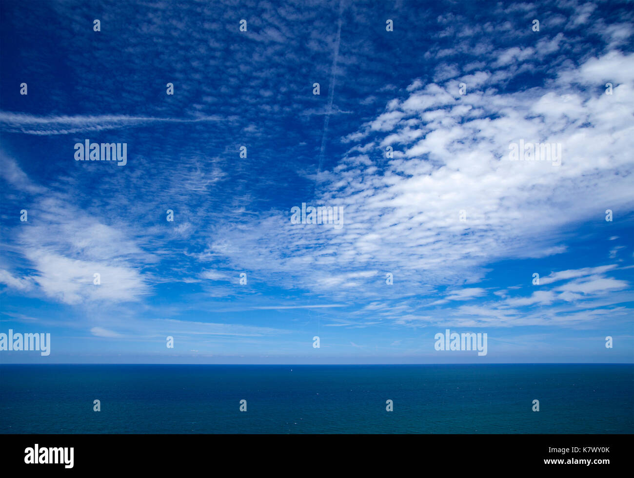 mackerel sky over calm ocean natural background Stock Photo