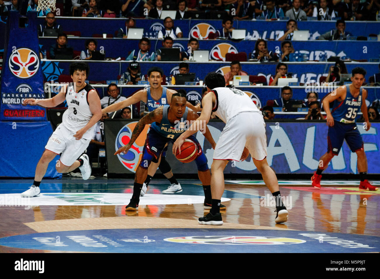 Philippines. 25th Feb, 2018. Calvin Abueva (8) guards against team Japan's Makoto Hejima (6) during the qualifying game at the MOA Arena. The Philippine and Japanese basketball team met at the hardcourt of the Mall of Asia Arena in Pasay City, for the FIBA World Cup 2019 Asian Qualifiers. The Philippines won over Japan, 89-84. Credit: J Gerard Seguia/ZUMA Wire/Alamy Live News Stock Photo