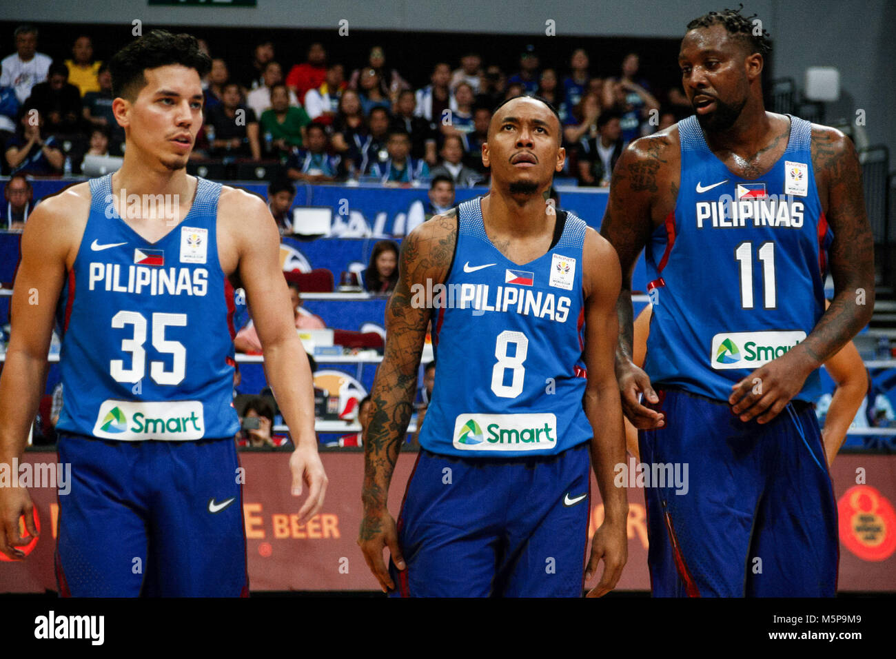 Philippines. 25th Feb, 2018. Matthew Wright (35), Calvin Abueva (8), and Andray Blatche (11) look on during the qualifying game at the MOA Arena. The Philippine and Japanese basketball team met at the hardcourt of the Mall of Asia Arena in Pasay City, for the FIBA World Cup 2019 Asian Qualifiers. The Philippines won over Japan, 89-84. Credit: J Gerard Seguia/ZUMA Wire/Alamy Live News Stock Photo