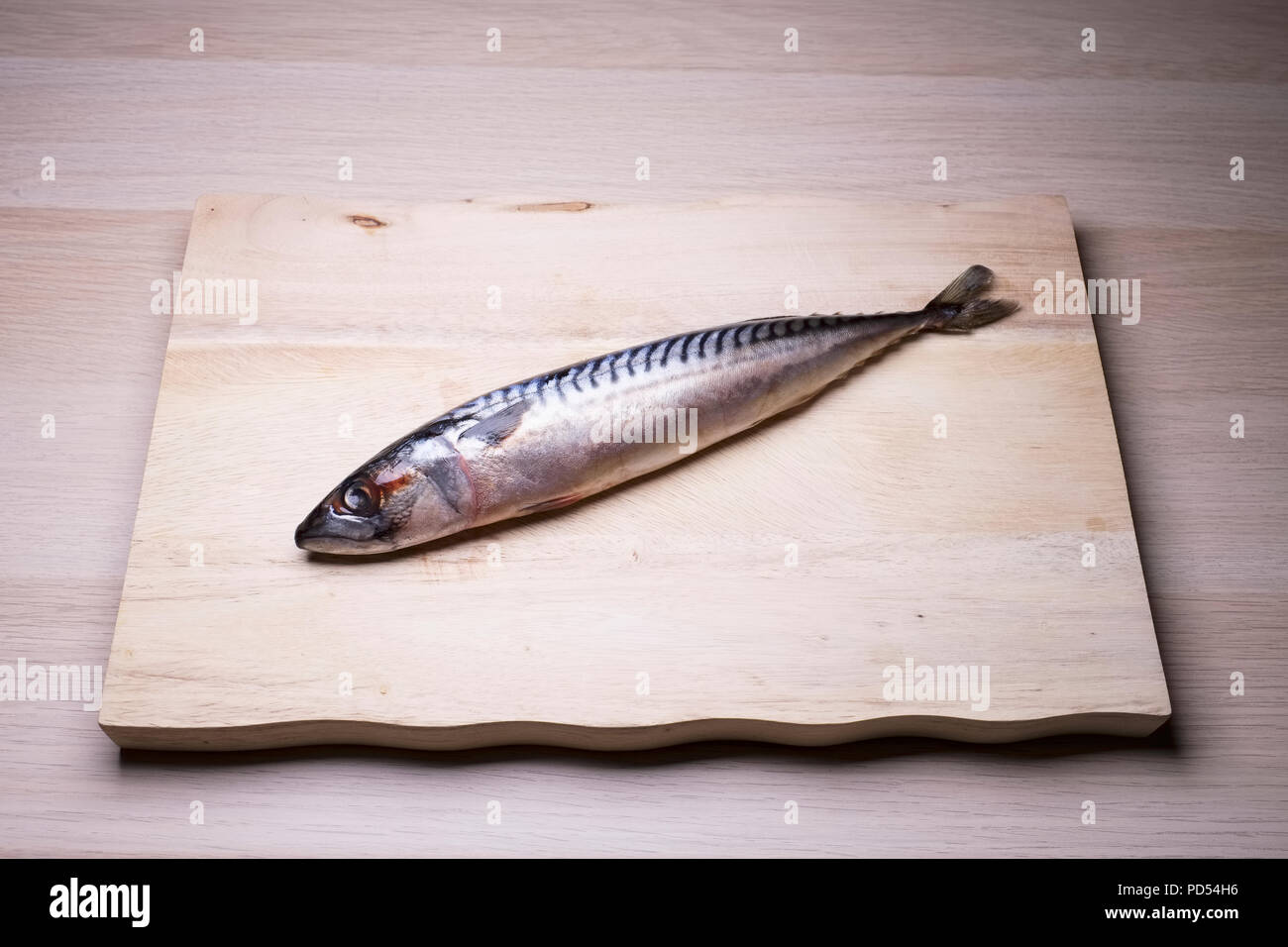 Mackerel raw fresh sea fish isolated wooden board healthy seafood Stock Photo