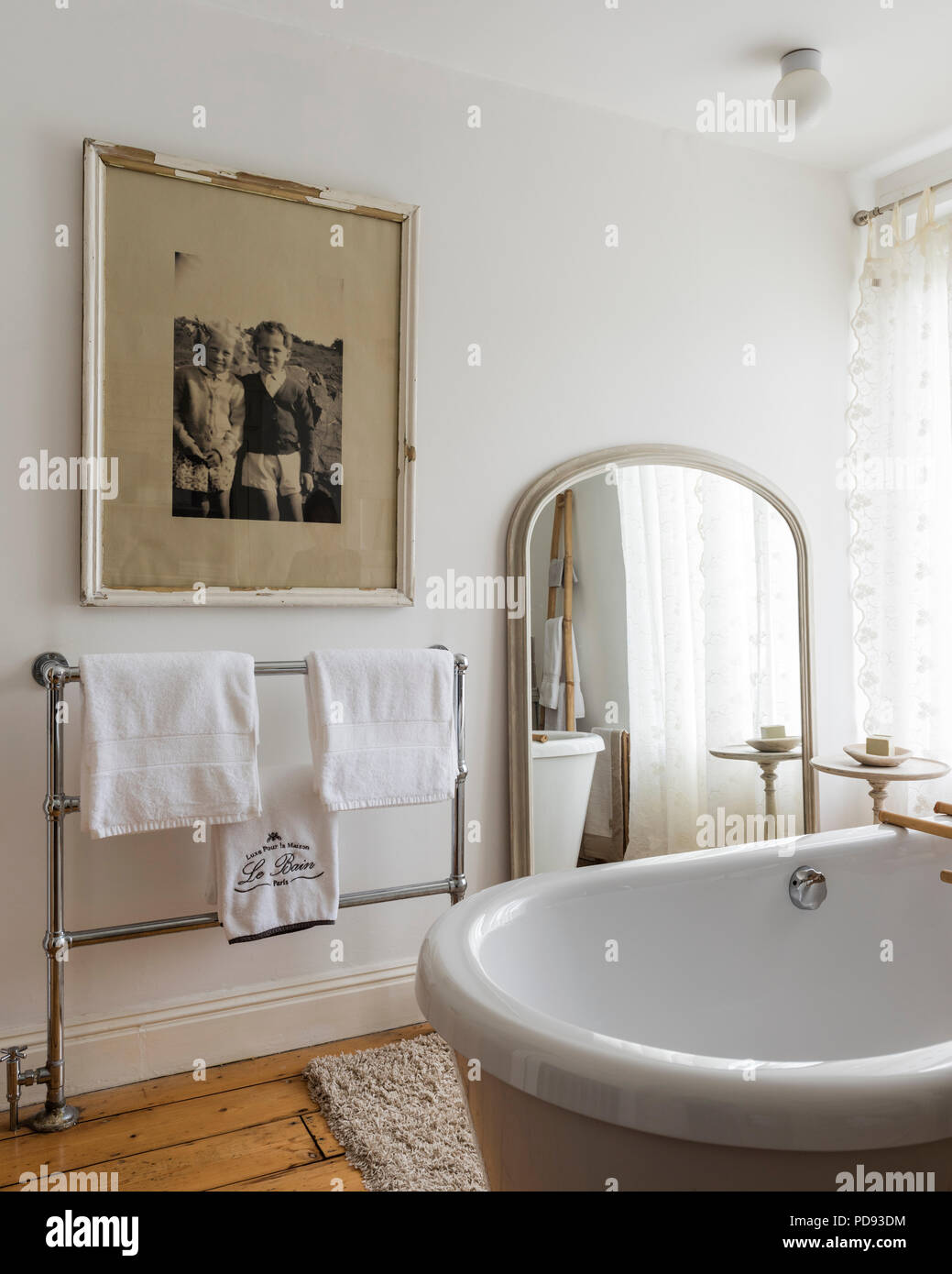 Black and white framed photograph in rustic bathroom Stock Photo