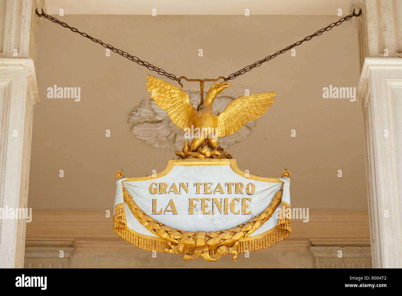 VENICE, ITALY - AUGUST 14, 2017: Theater La Fenice sign with golden phoenix in a sunny summer day in Venice, Italy Stock Photo