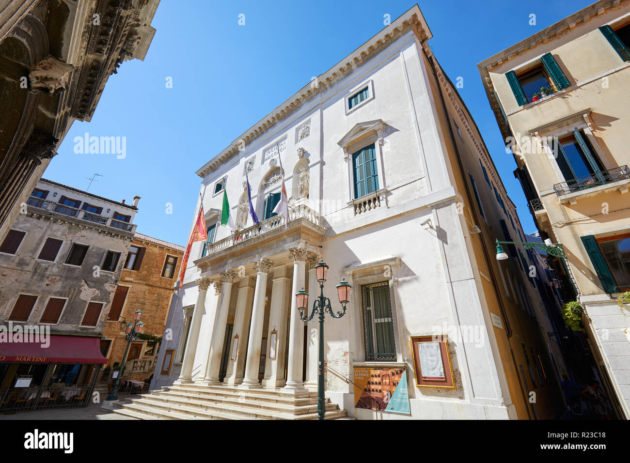 VENICE, ITALY - AUGUST 14, 2017: Teatro La Fenice building facade, low angle view in a sunny summer day, clear blue sky in Venice, Italy Stock Photo