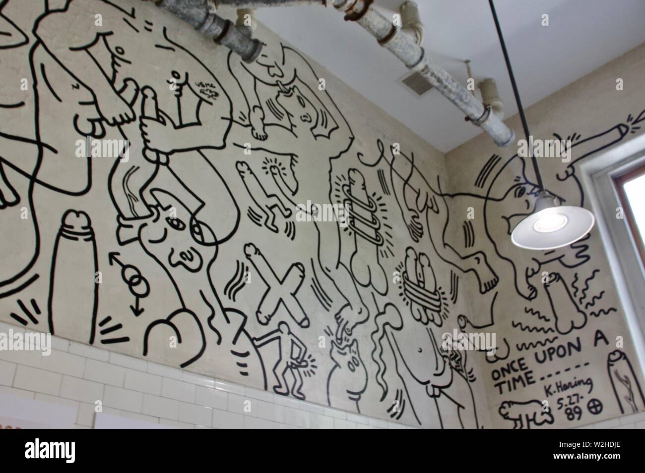 Once upon a time bathroom mural by Keith Haring at the LGBT Community Center in Manhattan, New York Stock Photo