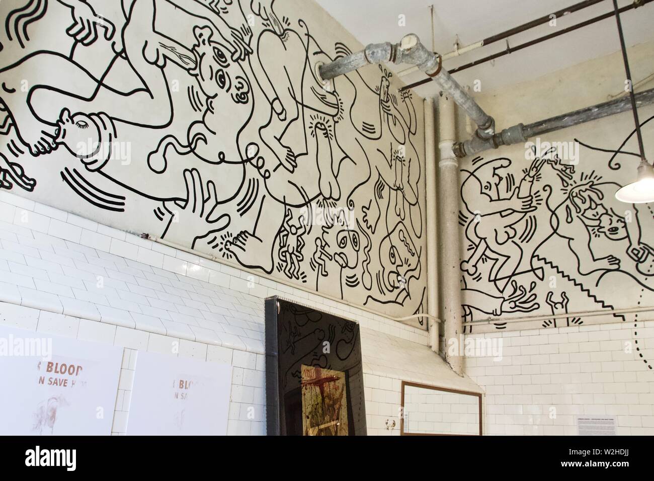 Once upon a time bathroom mural by Keith Haring at the LGBT Community Center in Manhattan, New York Stock Photo