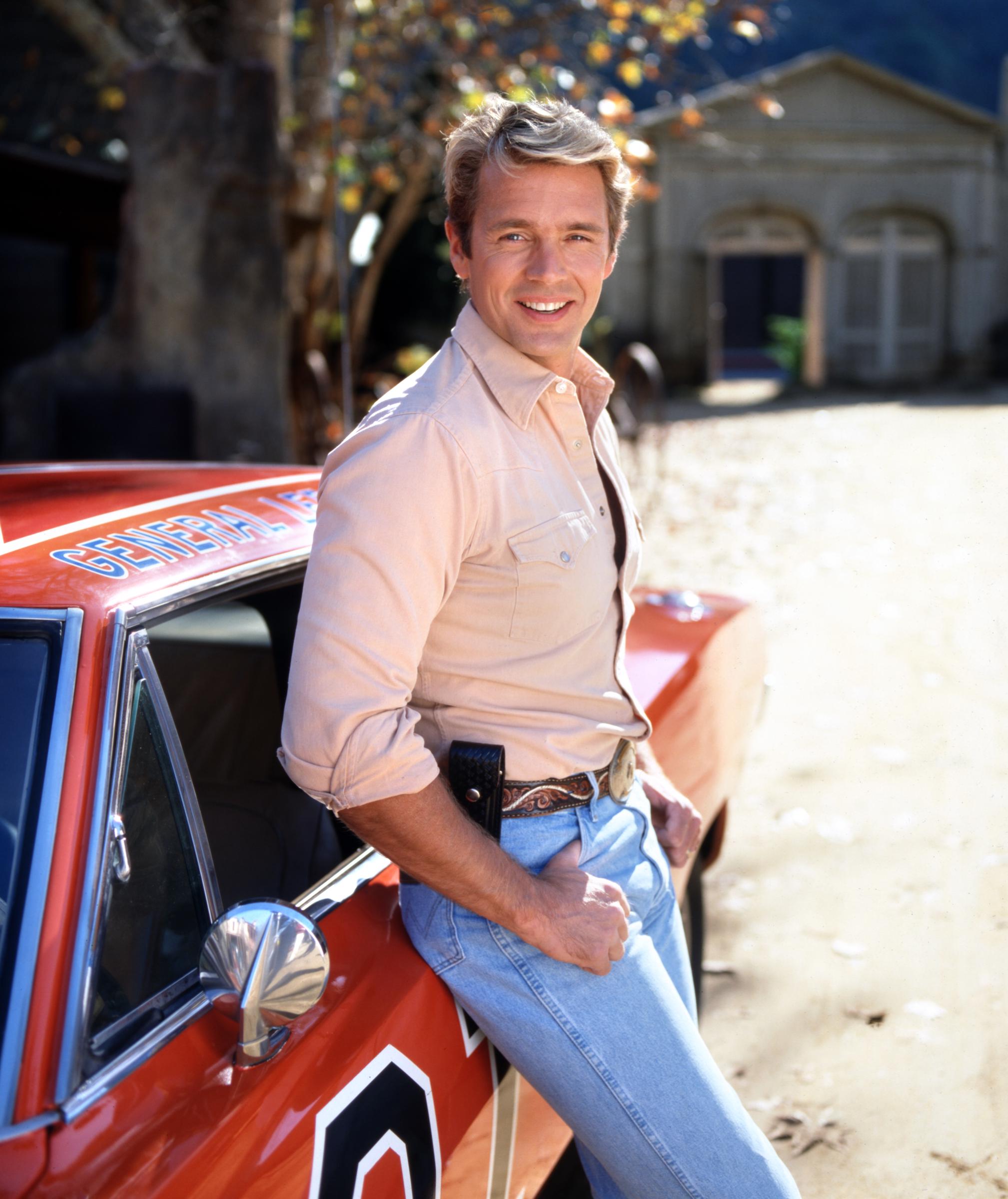 John Schneider on the set of "The Dukes of Hazzard: Reunion!" 1997 | Source: Getty Images