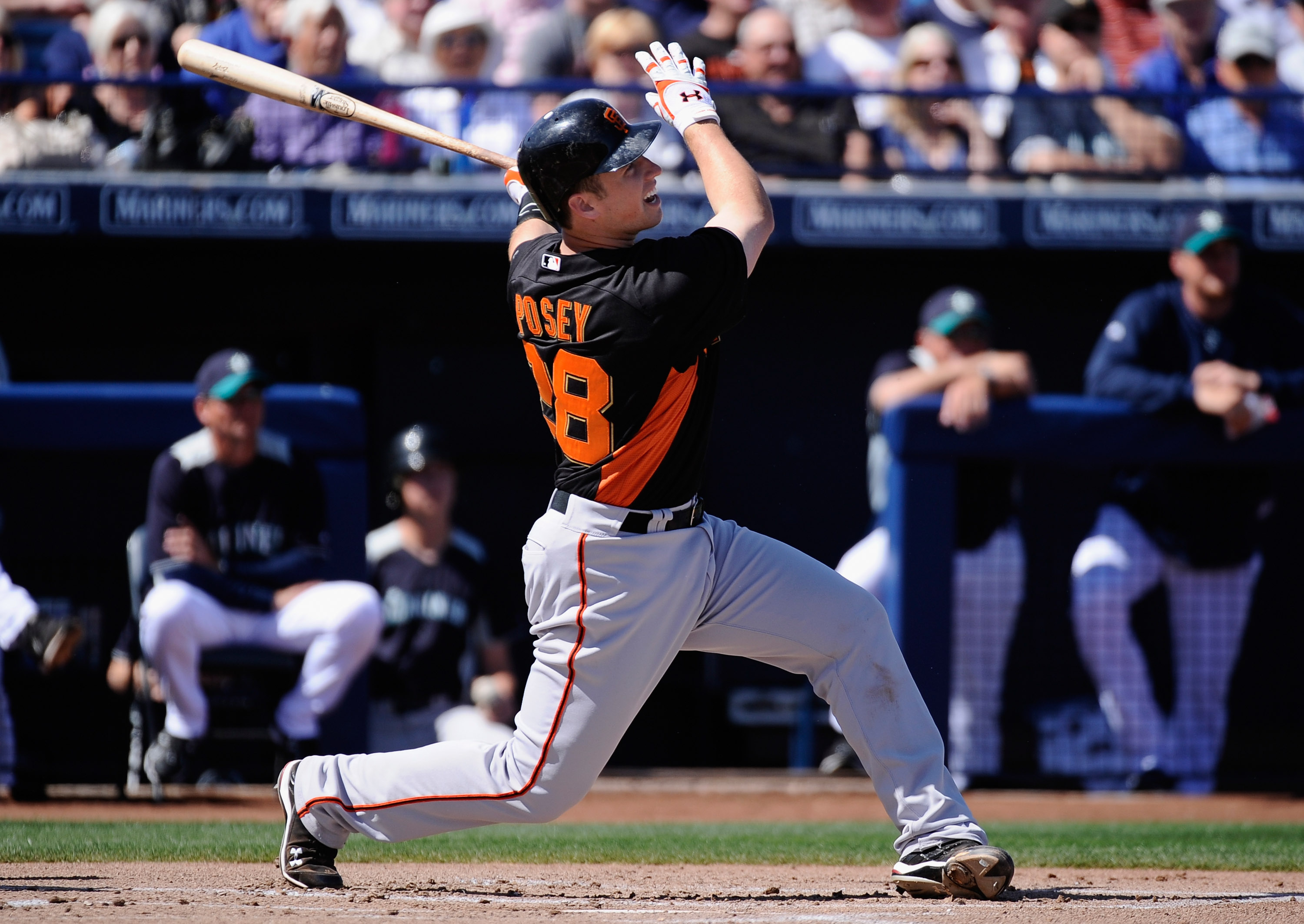 PEORIA, AZ - MARCH 08:  Buster Posey #28 San Francisco Giants swings at a pitch against the Seattle Mariners during the spring training baseball game against at Peoria Stadium on March 8, 2011 in Peoria, Arizona.  (Photo by Kevork Djansezian/Getty Images)