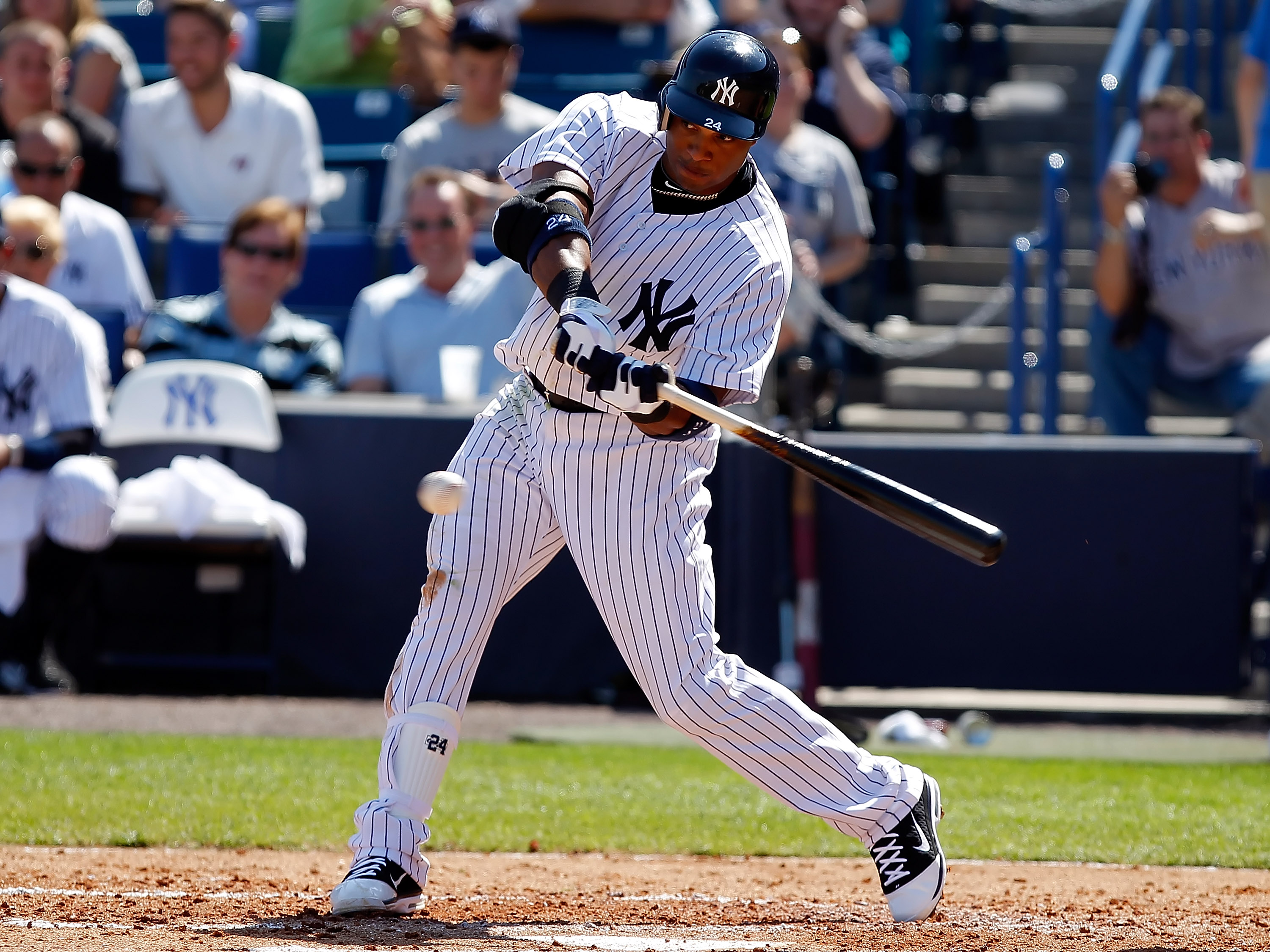 TAMPA, FL - FEBRUARY 26:  Infielder Robinson Cano #24 of the New York Yankees fouls off a pitch against the Philadelphia Phillies during a Grapefruit League Spring Training Game at George M. Steinbrenner Field on February 26, 2011 in Tampa, Florida.  (Pho